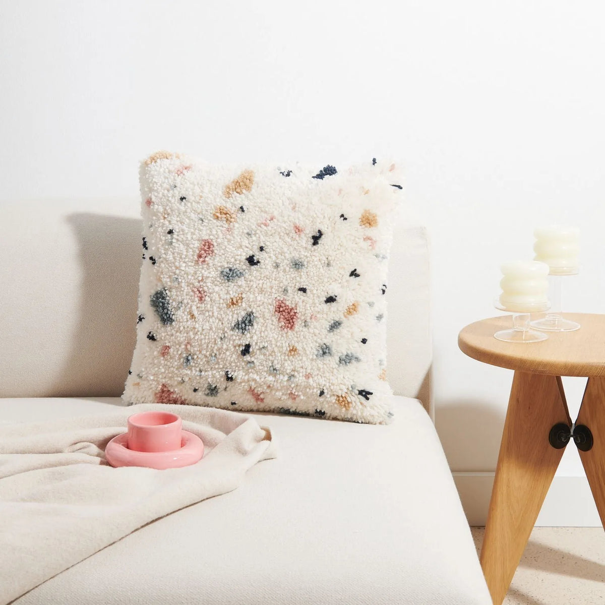 Latch hook rug kit with terrazzo cushion design by Rico Design