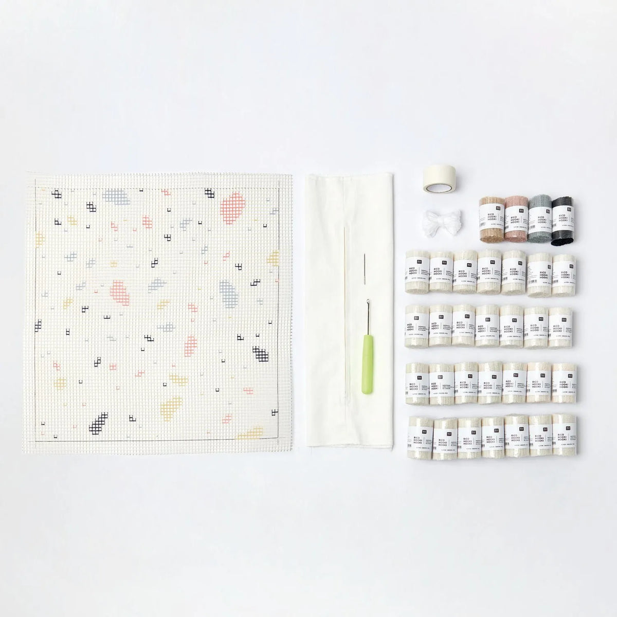 Latch hook rug kit with terrazzo cushion design by Rico Design