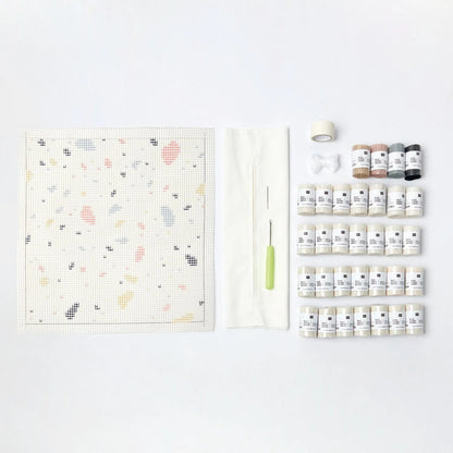 Latch hook rug kit with terrazzo cushion design by Rico Design