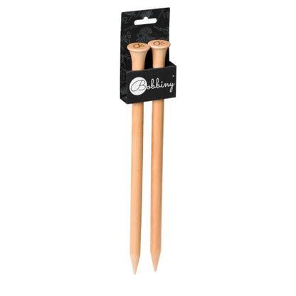 Beech wood knitting needles held in hand, in use