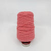 Tufting wool cone close-up showing yarn texture