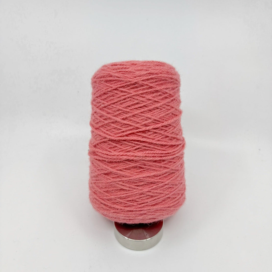 Tufting wool cone close-up showing yarn texture