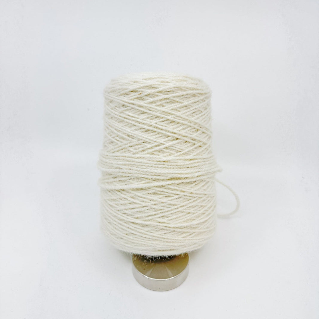 Tufting wool cone with yarn end detail